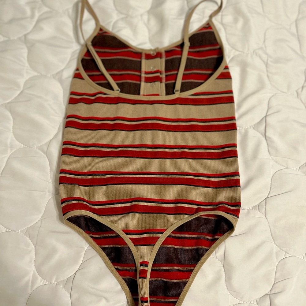 Forever 21 striped red and brown body suit with snap detailing at the top.
